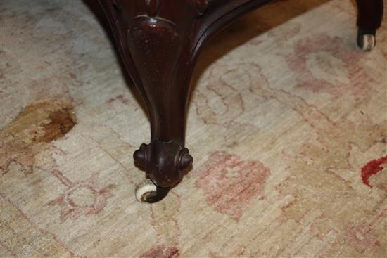 A Victorian carved rosewood open arm settee W.132cm